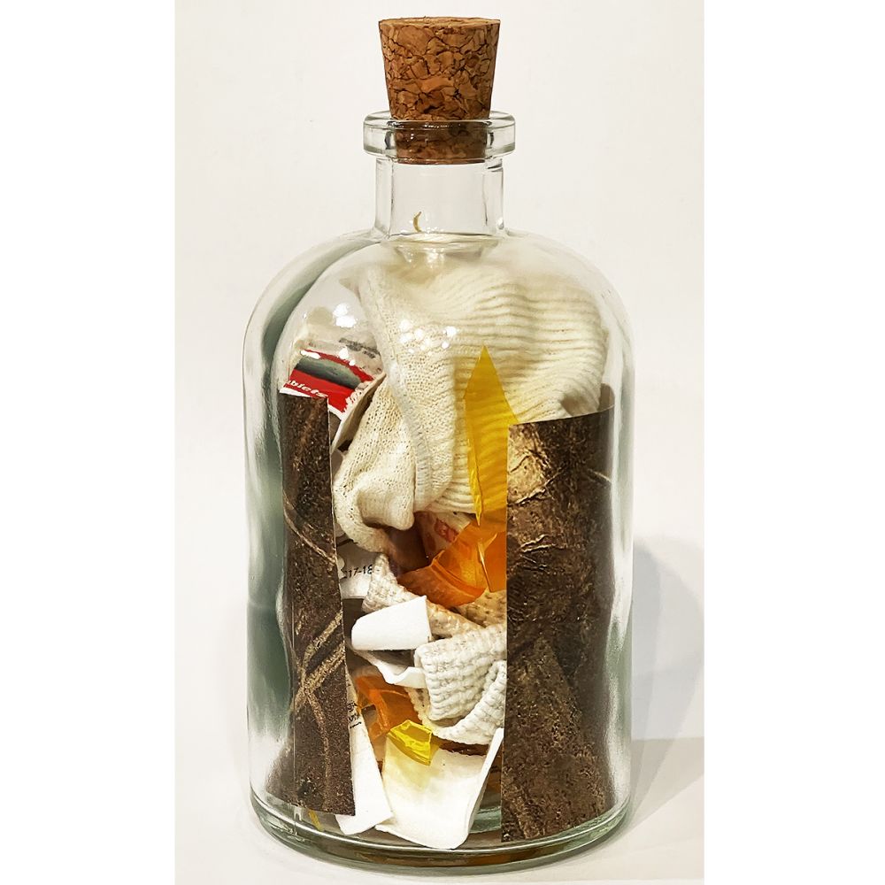 <br/>Rousanne Praetorian back, 10/9/2025<br/>Apx 6½" x 3" x 3"<br/>glass, paper, ink, cork, plastic and cloth